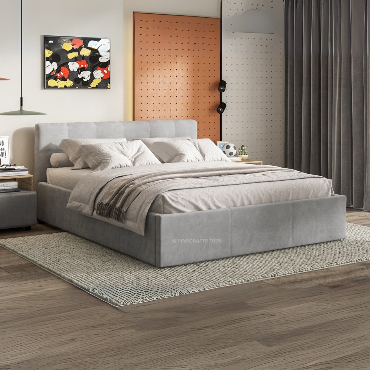 Gray upholstered bed in a modern bedroom with decor elements.